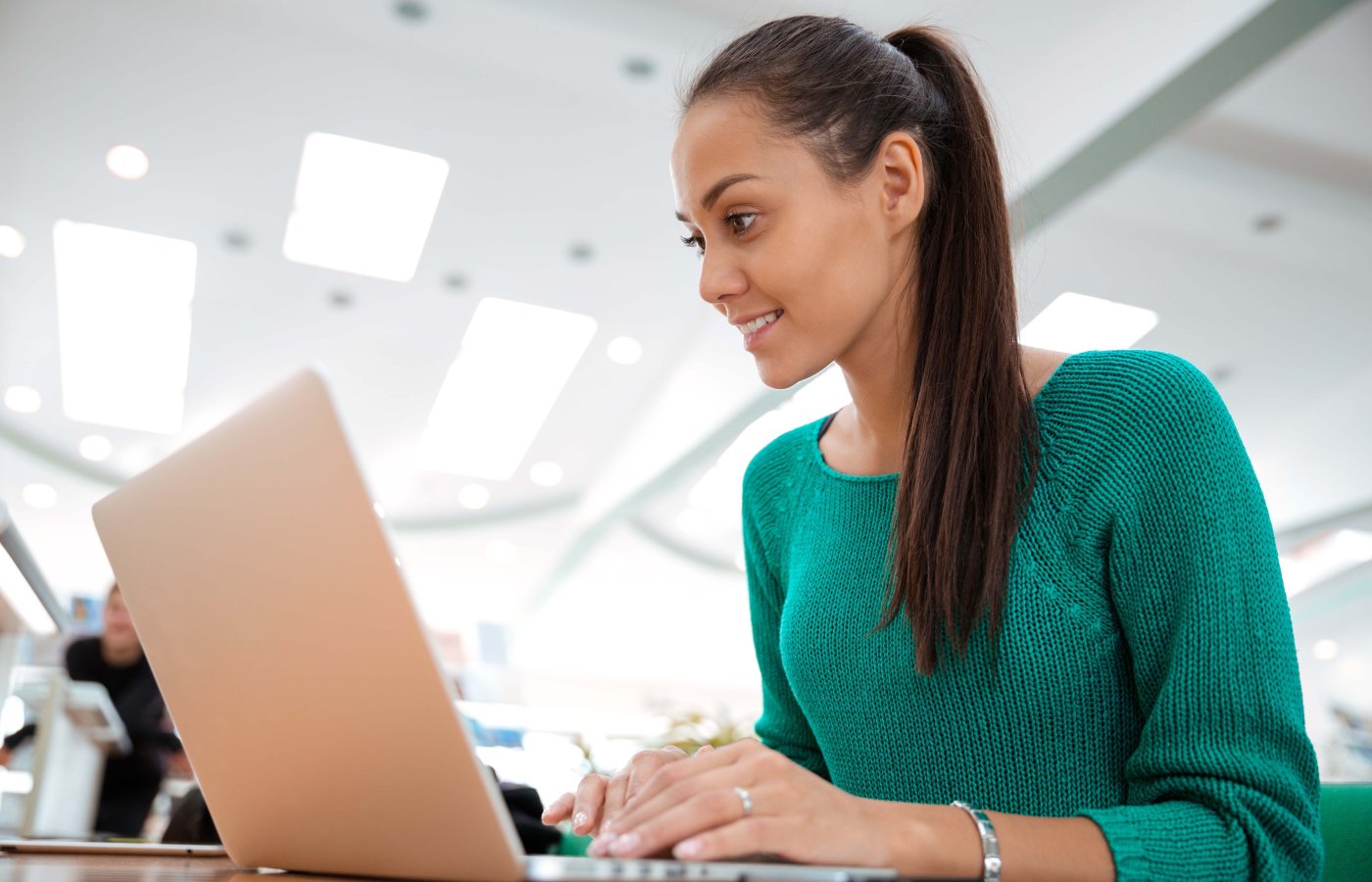 Close-up of a woman working at a laptop computer