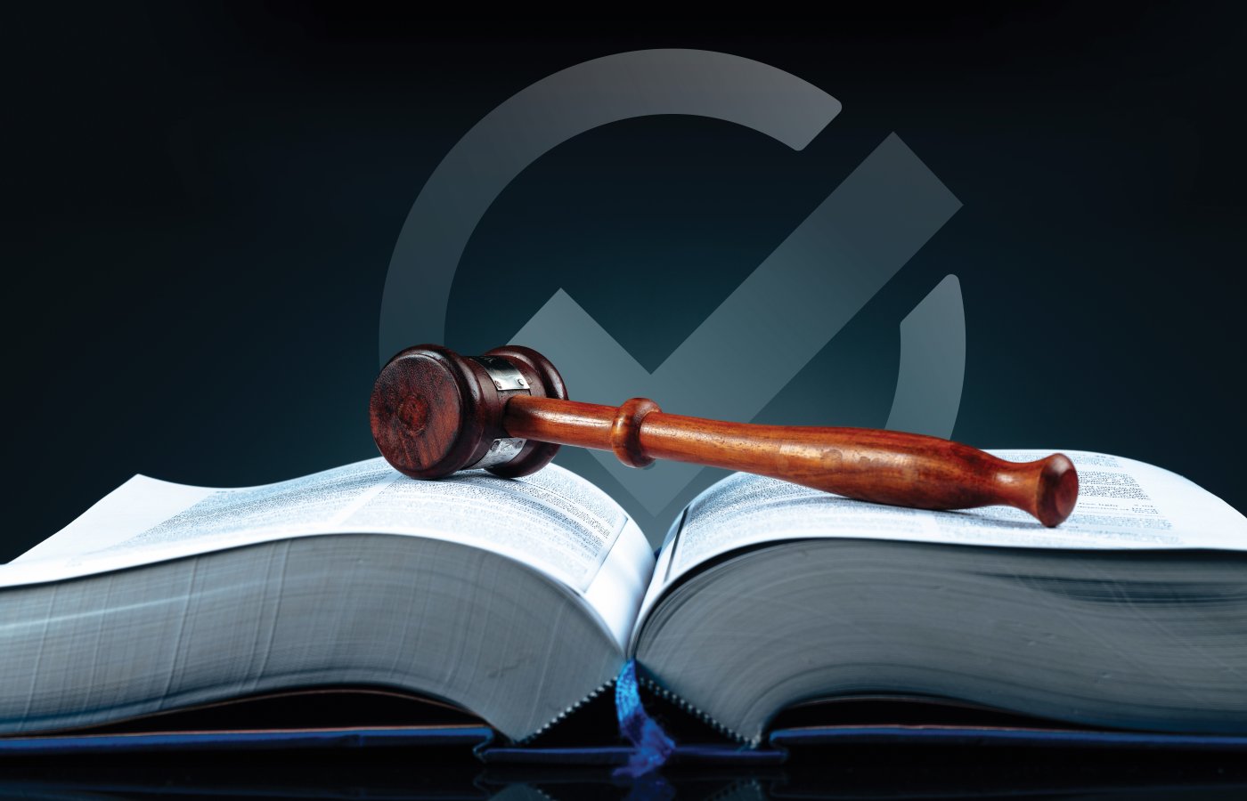 image of gavel on open book with checkmark in background