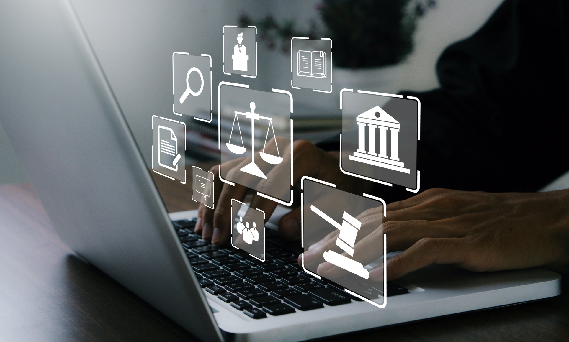law-related icons such as a gavel, scale, person are floating in the air above a computer laptop with hands typing