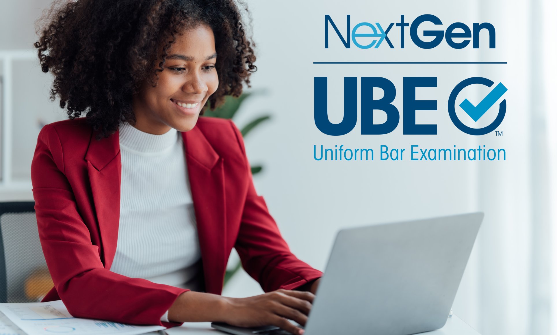 person on computer with NextGen UBE logo on side