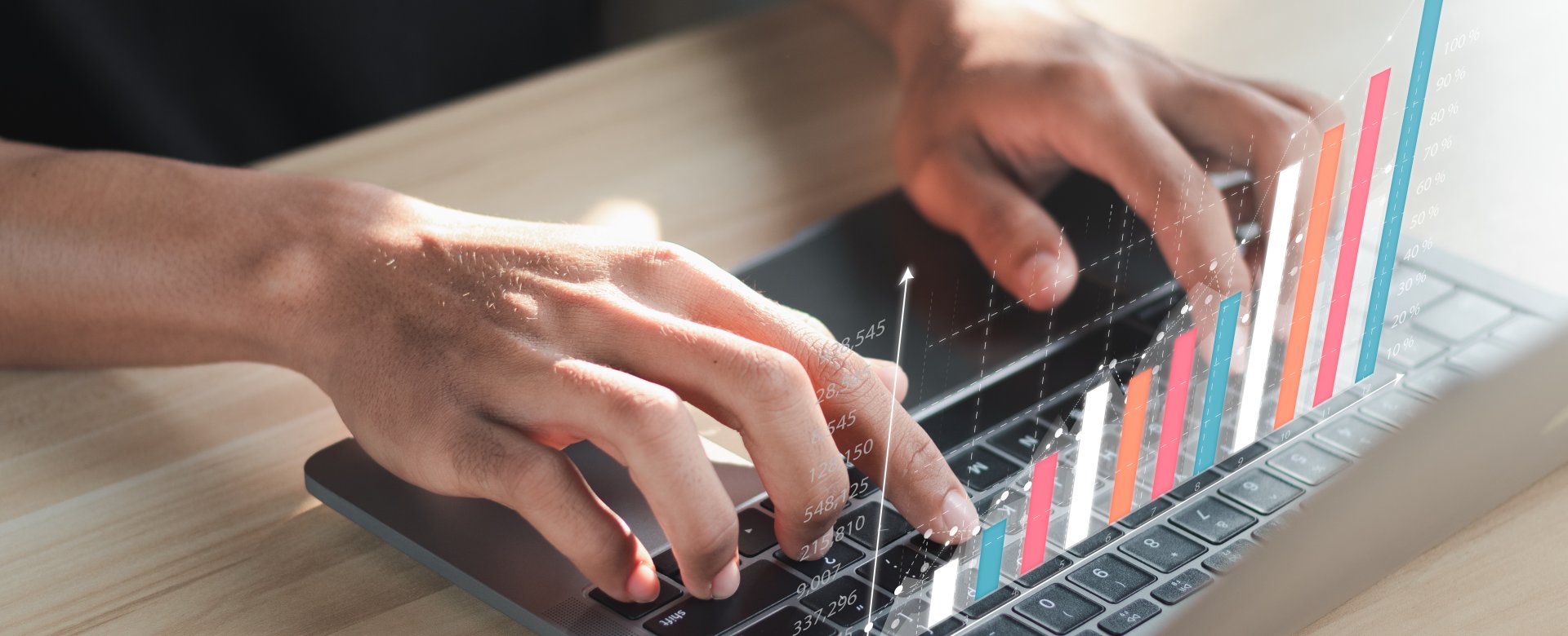 person's hands on keyboard with bar graph
