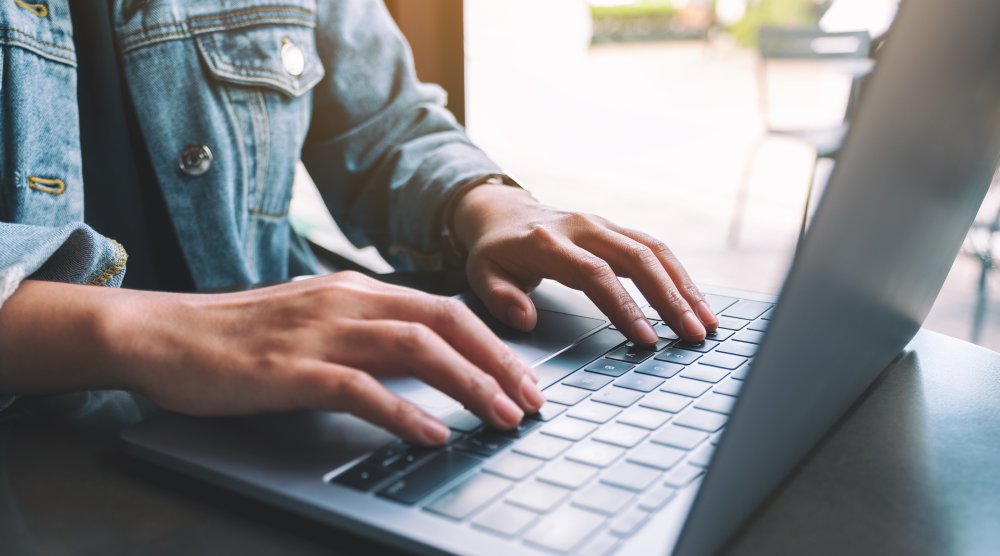 image of hands on computer keyboard